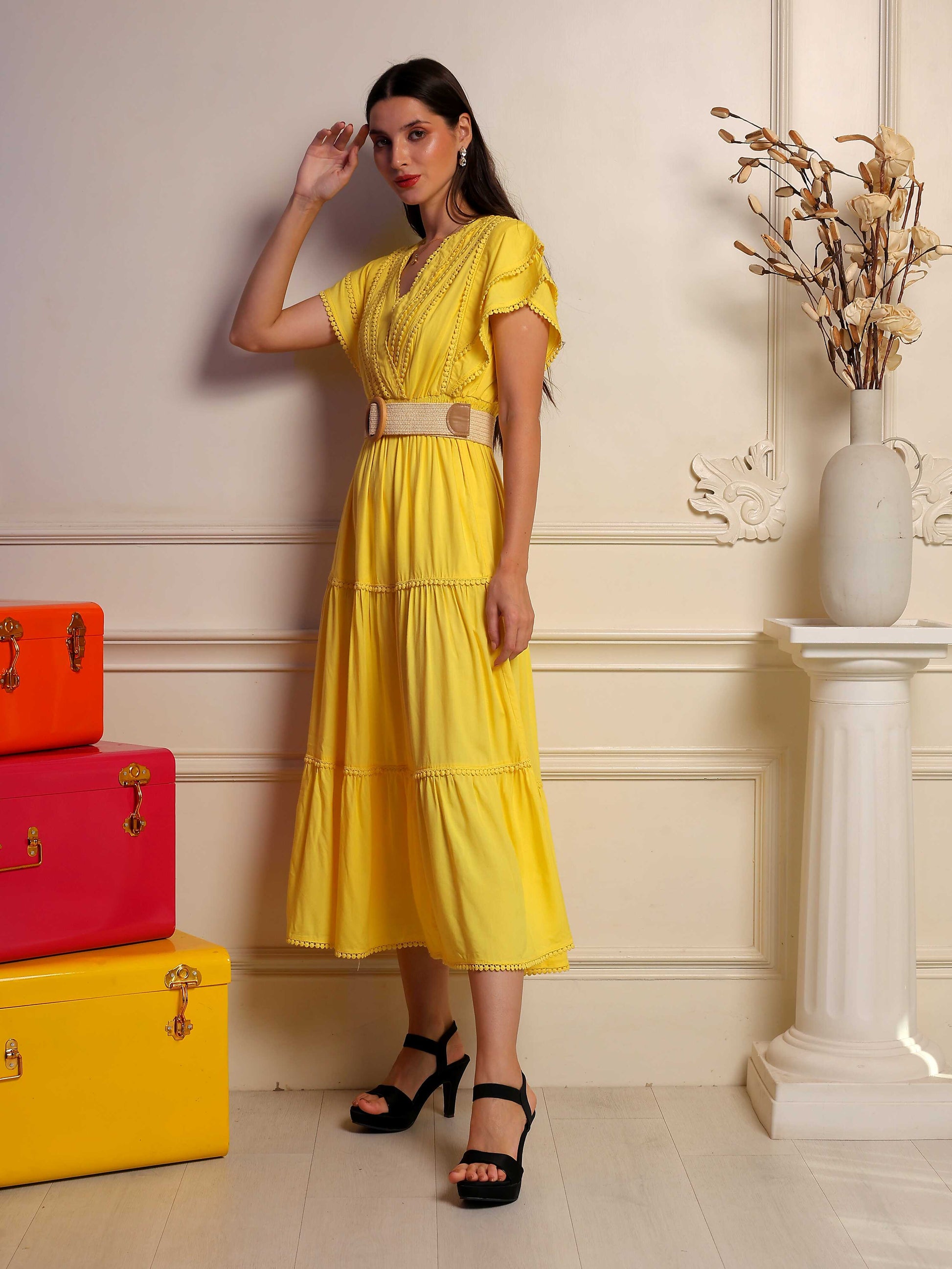 Sunlit Mustard Midi Dress by Fabium Fashion, flowing dress with sleeveless design and cinched waist, shown on a model.