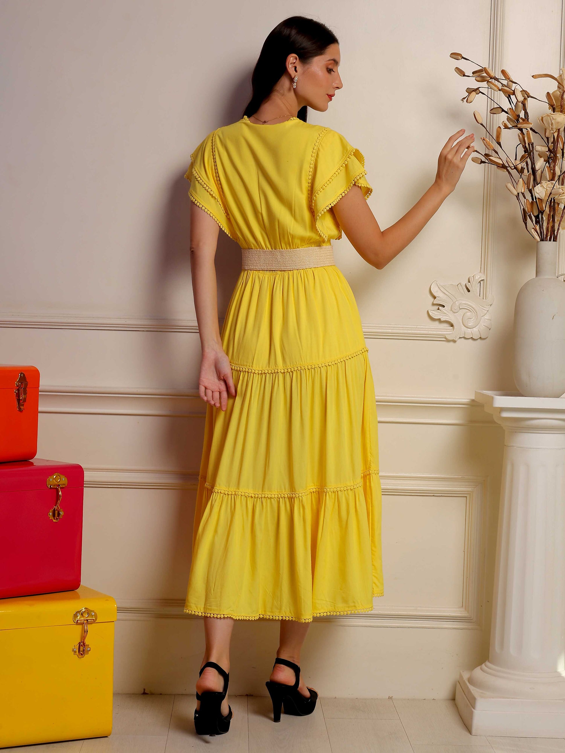 Sunlit mustard midi dress by Fabium Fashion featuring a flowing silhouette and elegant design, shown on a model.